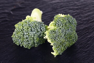 Broccoli isolated isolation on the black SLATE