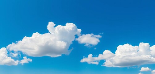 Vast, clear blue sky panorama with fluffy white clouds, serenity, panorama