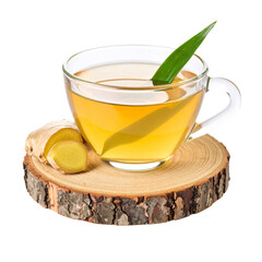 Ginger tea in glass cup on wooden coaster