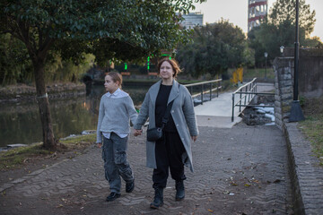 Happy family having fun in park. Mother and daughter portrait