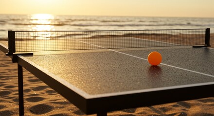Outdoor table tennis setup on beach at sunset with sea background  