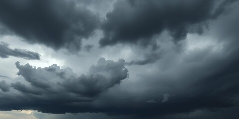 Obraz premium Heavy, dark gray storm clouds fill the frame, imminent rain , precipitation, atmospheric pressure