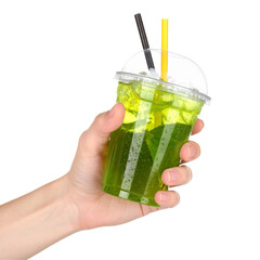 Hand holding green refreshing beverage in plastic cup
