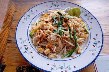 A plate of delicious phad thai or stir-fried rice noodle which is the most popular dish in Thailand