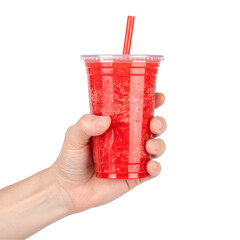 Hand holding red beverage in transparent plastic cup with straw against black background