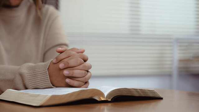 Woman reading the holy bible in morning, worship and pray.devotion concept
