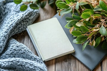 Fototapeta premium A flat lay of a motivational quote card with a plant and a notebook beside it