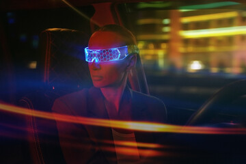 Woman in Futuristic High-tech VR Eyewear driving car in night ci