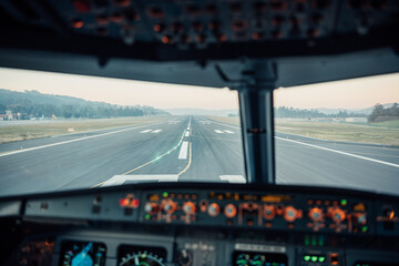 View from airplane cockpit aligned on runway ready for takeoff