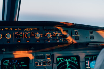 Illuminated control panel in commercial aircraft cockpit