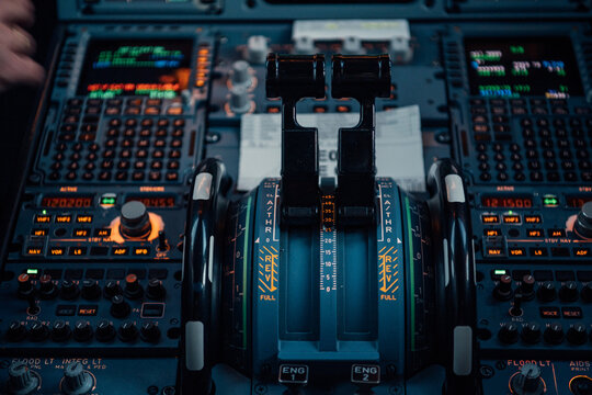 Throttle levers and control panel in commercial aircraft cockpit