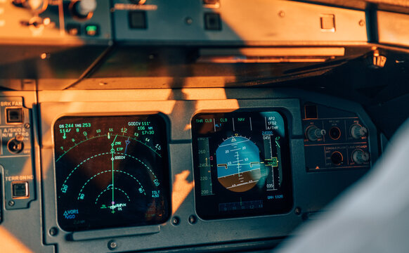 Close-up of aircraft navigation and attitude indicators during flight