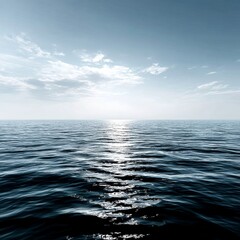 Obraz premium Calm Ocean Reflections: Sunlight Glinting on Gentle Waves Under a Cloudy Blue Sky, a Serene Seascape