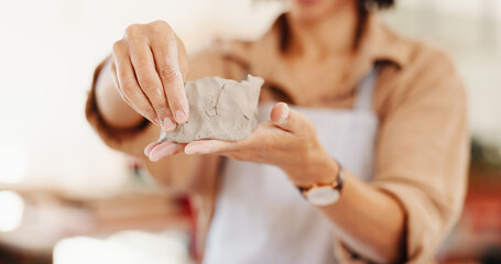 Workshop, hands and art with clay for pottery, creative design, sculpture and learning skills in studio. Female person, small business and potter in closeup for diy hobby, experience and handmade