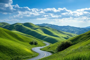 Fototapeta premium Winding scenic road through lush green hills