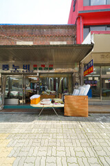A traditional market building in South Korea, featuring a lively atmosphere and showcasing local culture and products.
