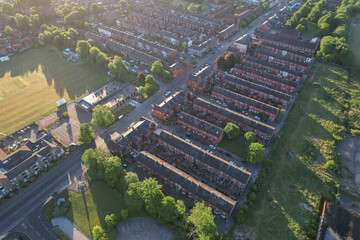 Aerial top down view of houses in England - with typical British houses and green gardens - Real estate and buildings concepts in UK.