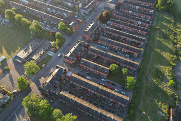 Aerial top down view of houses in England - with typical British houses and green gardens - Real estate and buildings concepts in UK.