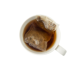 Herbal tea sachet in cup, hot water with chamomile and Hypericum or St. John's wort teabag