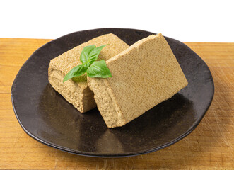 Tofu Cheese Isolated, Smoked Vegan Cheese Slice, Sliced Soya Bean Curd, Soy Protein or TSP