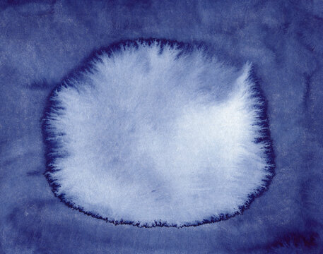 Abstract blue watercolor painting with a central spot and copy space