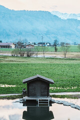 Small wooden cabin in Alps countryside