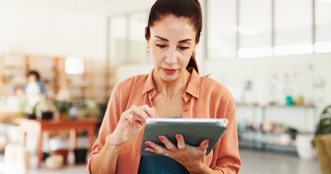 Pottery, creative and woman in workshop on tablet for inventory, planning and checklist of ceramic designs. Business, art studio and person on digital tech for DIY hobby, handicraft and website