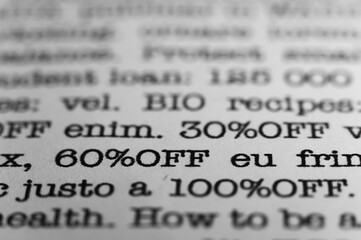 60 percent off. Text printed on a page. A piece of paper with a phrase. Marketing.