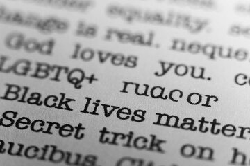 Fototapeta premium Black lives matter. Text printed on a page. A piece of paper with a phrase written in retro typewriter font