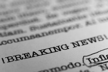 Breaking News headline. Text printed on a page. A piece of paper with a phrase written in retro...