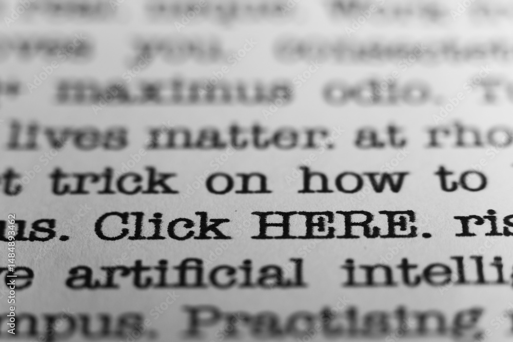 Fototapete click here. text printed on a page. a piece of paper with a phrase written in retro typewriter font