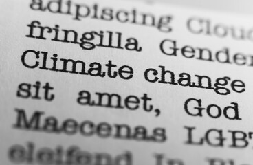 Climate change. Text printed on a page. A piece of paper with a phrase written in retro typewriter...