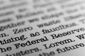Federal Reserve. Text printed on a page. A piece of paper with a phrase written in retro typewriter...