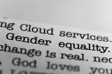 Gender equality. Text printed on a page. A piece of paper with a phrase written in retro typewriter font