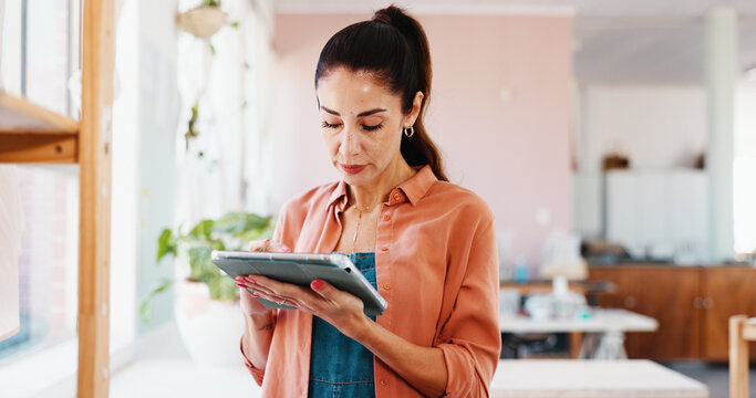 Pottery, tablet and woman in art studio for inventory, logistics and checklist for ceramic designs. Creative business, workshop and person on digital tech for DIY hobby, planning and store website