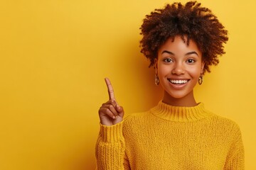 Happy African-American girl pointing at empty space for text