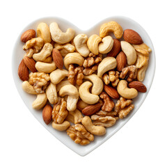 Assortment of delicious healthy nuts including almond hazelnut walnut and cashew arranged in a white heart shaped bowl top view concept for snack or Valentine Day symbol of healthy eating and love.