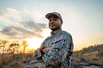 Us Army veteran honors Veterans Day. Man soldier adjusts the US military patch before duty. A US...