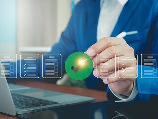Digital Document Audit Businessman using laptop and tablet to approve digital document audit list online, check online form on internet to increase efficiency, business management.