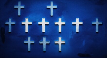 Obraz premium A collection of white crosses arranged on a deep blue background