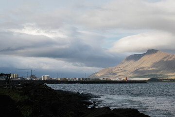 Scenic coastal view of Akranes with mountains and ocean, Iceland's natural beauty