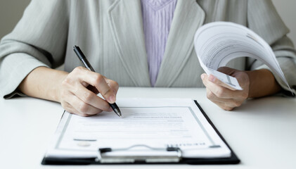 Business woman employer holding resume hiring recruit looking cv resume to hire candidates, analyzing information before job interview. Recruitment concepts