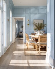 Bright interior with table chairs artwork and doorway showcasing a serene home atmosphere.