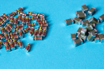 Electronic components: diodes and capacitors on blue background