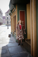 young beautiful woman in vintage suit in european city
