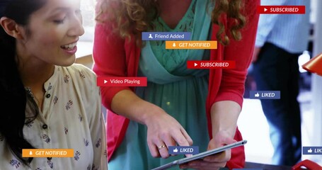 standing woman pointing at tablet, seated woman watching with UI notifications boosting marketing