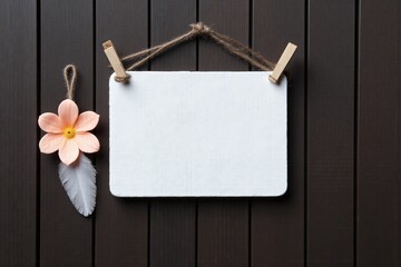 chalkboard with a flower on it hanging on a wooden wall