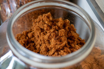 A close-up shot of Abon Sapi, a shredded beef floss, showcasing its fibrous texture and savory, golden-brown appearance.