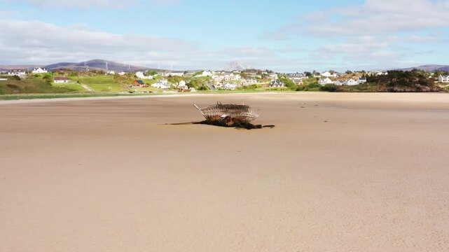 Aerial Orbit of the Bad Eddie Shipwreck with Bunbeg Village and Mount Errigal in the Background