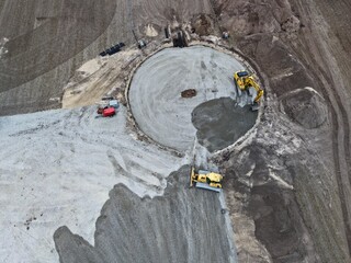 aerial view of the civil engineering work for the construction of a wind turbine, wind turbine, civil engineering, excavator, bulldozer, wind energy, land use, energy transition, foundation
